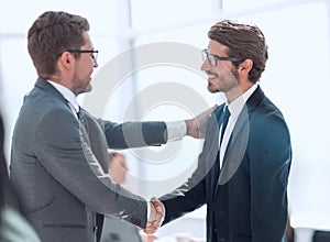 welcome handshake business partners in the office