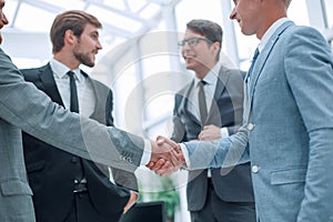 Welcome handshake of business people in the office