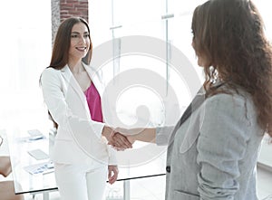 Welcome handshake women business partners