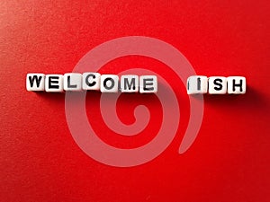 Welcome ish words on a red background  fun and playful