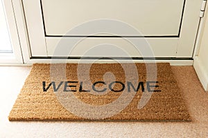 Welcome Mat Inside Doorway Of Home photo