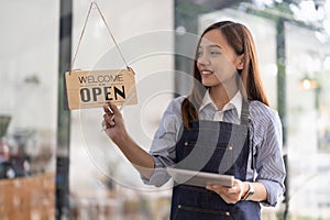 Welcome open shop barista waitress open sign on glass door modern coffee shop ready to serve restaurant cafe retail