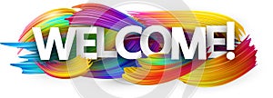 Welcome paper banner with colorful brush strokes.