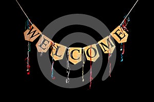 Welcome party banner. Bunting letters spelling the word welcome.