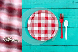Welcome picnic setting sign on blue wood background