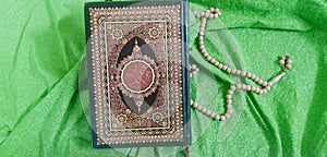 Welcome Ramadan Kareem with holy Qur`an and tasbih rosary