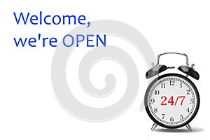 Welcome we`re OPEN sign in blue and white, on shop door
