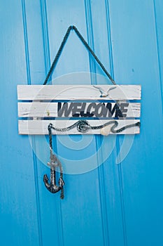 Welcome sign at apartment doors near Panormos at the island of Skopelos