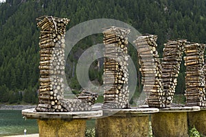 Welcome sign with bicycle straw sculpture in Livigno, Italy