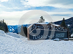 Welcome sign on a billboard in a ski resort, Turracher Höhe
