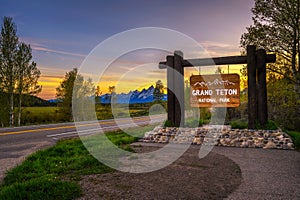 Welcome sign at the entrance to Grand Teton National Park in Wyoming at sunset