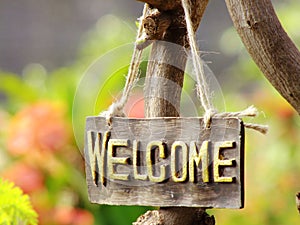 Welcome sign hanging in the garden