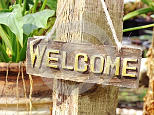 Welcome sign hanging in the garden