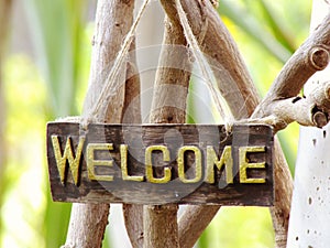 Welcome sign hanging in the garden