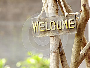 Welcome sign hanging in the garden