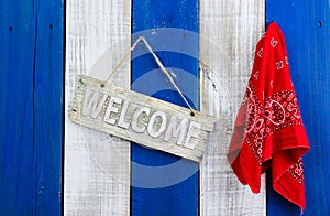 Welcome sign hanging by red paisley bandanna