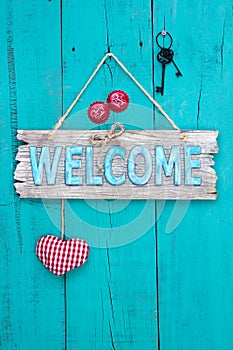 Welcome sign hanging on rustic wood door