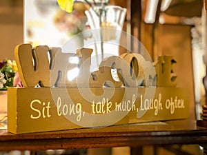 Welcome Sit Long, Talk Much, Laugh Often