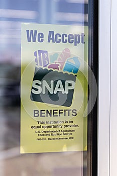 We Welcome SNAP Benefits sign. SNAP and Food Stamps provide nutrition benefits to assist disadvantaged families
