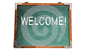 Welcome! text message in white chalk written on a school green old grungy vintage wooden chalkboard or blackboard