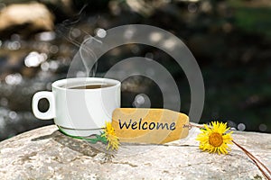 Welcome text with coffee cup photo