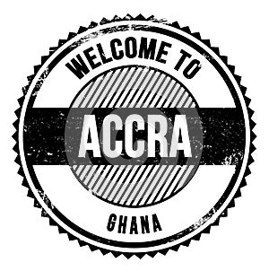 WELCOME TO ACCRA - GHANA, words written on black stamp