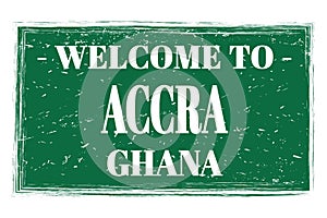 WELCOME TO ACCRA - GHANA, words written on green stamp