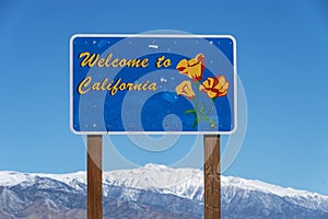 Welcome To California Road Sign With White Mountain