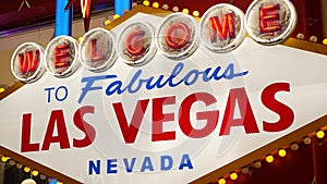 Welcome to fabulous Las Vegas retro neon sign in gambling tourist resort, USA. Iconic vintage glowing banner, symbol of casino,