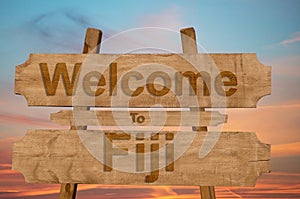 Welcome to Fiji sing on wood background