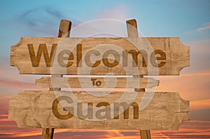 Welcome to Guam sing on wood background