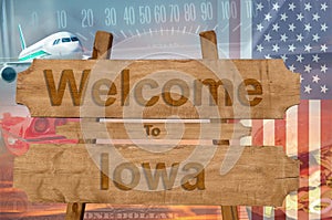 Welcome to Iowa state in USA sign on wood, travell theme