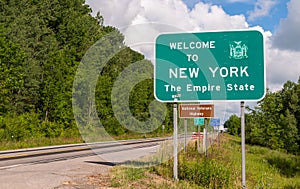 The Welcome to New York state line sign on US Route 62 in Chautauqua County, New York, USA
