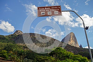 Welcome to Rota do Lagarto plaque, with Pedra Azul rock formation on back. Domingos Martins, ES, Brazil photo