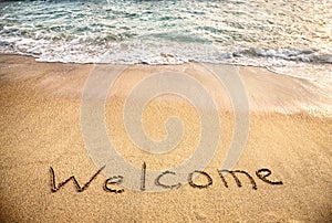 Welcome word on the sand