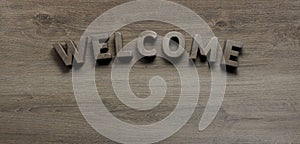 Welcome word wrote on wooden background