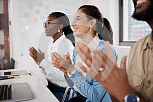 Welcoming new life to the team. a group of businesspeople clapping during a meeting in a modern office.