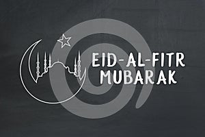 Welcoming ramadan. Eid-Al-Fitr mubarak text on chalkboard. photo