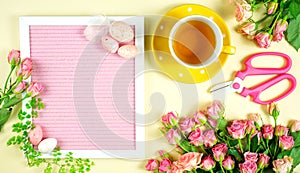 Welcoming Spring theme concept tea break with pink roses and female accessories.