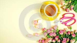 Welcoming Spring theme concept tea break with pink roses and female accessories.