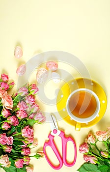 Welcoming Spring theme concept tea break with pink roses and female accessories.