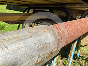 Weld joint between iron metal industrial old rusty pipe and new stainless steel pipe