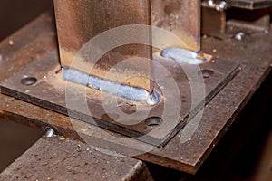 Weld joint joining two metal parts. welding seam. on steel sheet metal.