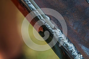 Weld on a metal profile and a welding electrode.