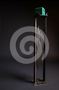 Welded candlestick with black backdrop photo