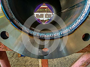 Welded between flange and piping in process Gas Tungsten Arc Welding GTAW