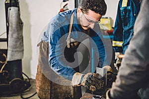 Welder checking angle of welded materials