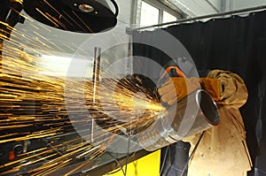 Welder. Cleaning of the finished weld seam.