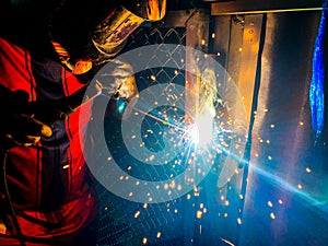 Workers are welding structural steel.