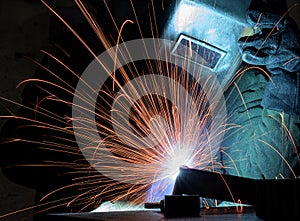 Welder, craftsman, erecting technical steel Industrial steel welder in factory